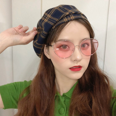 Μοντέρνα γυναικεία στρογγυλά γυαλιά με λεπτό σκελετό