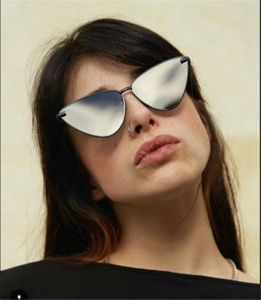 Modernas sieviešu brilles ar nestandarta formu un spoguļa efektu