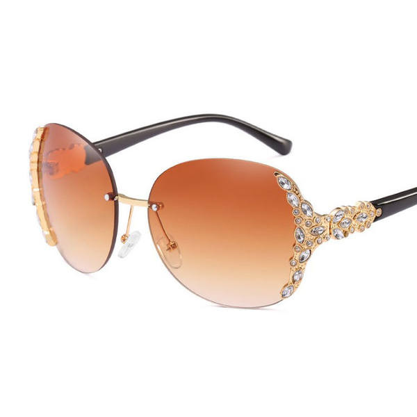 Κομψά γυναικεία γυαλιά ηλίου με διακοσμητικές πέτρες και λεπτό σκελετό