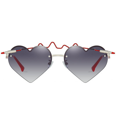 Sieviešu brilles ar plānu ietvaru un sirds formas brillēm