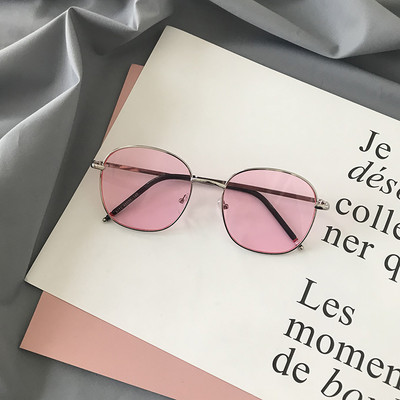 Modernas sieviešu brilles ar apaļu formu un plāniem metāla rāmjiem