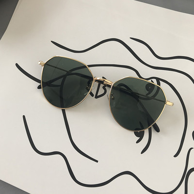 Modernas saulesbrilles ar apaļu formu un plāniem rāmjiem