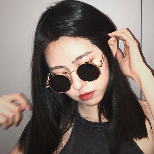 Sieviešu brilles ar apaļu formu un plāniem rāmjiem