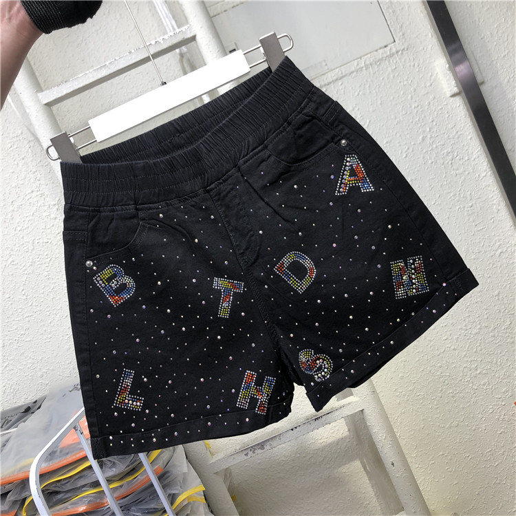 Aktuāli sieviešu šorti ar augstu vidukli un dekoratīviem akmeņiem