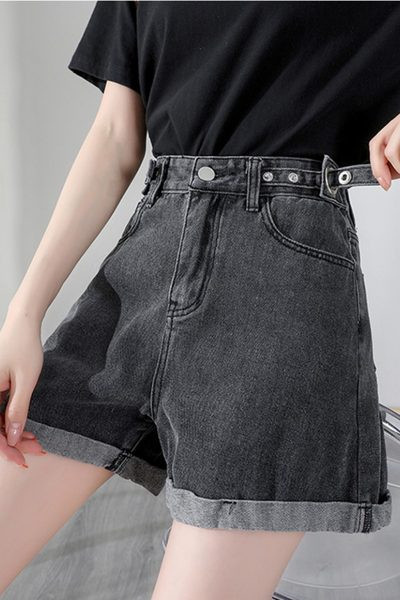 Sieviešu džinsi ar pogām un augstu vidukli