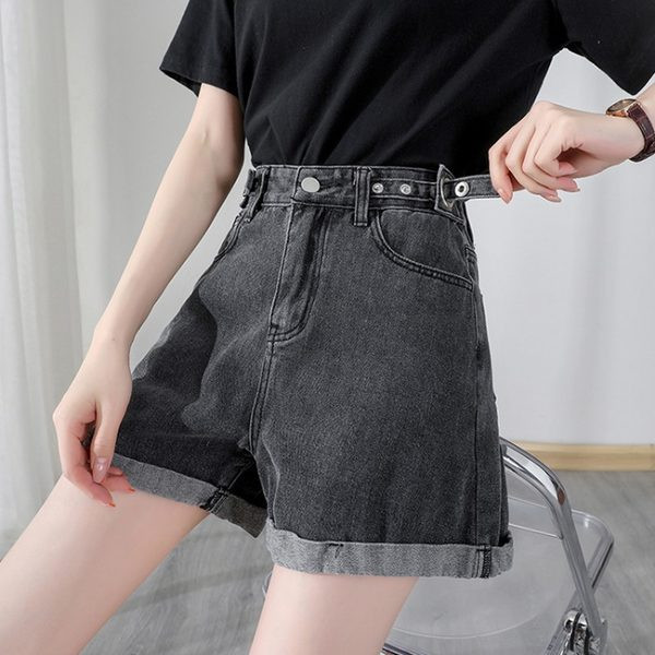 Sieviešu džinsi ar pogām un augstu vidukli