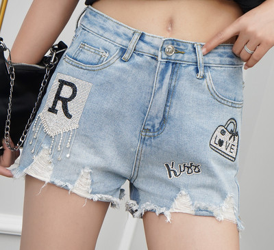 Moderni sieviešu šorti ar dekoratīviem akmeņiem