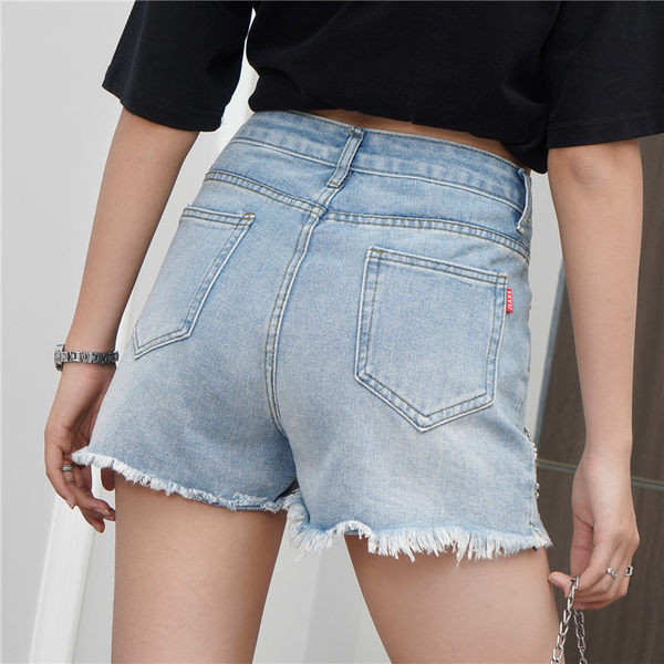 Moderni sieviešu šorti ar dekoratīviem akmeņiem