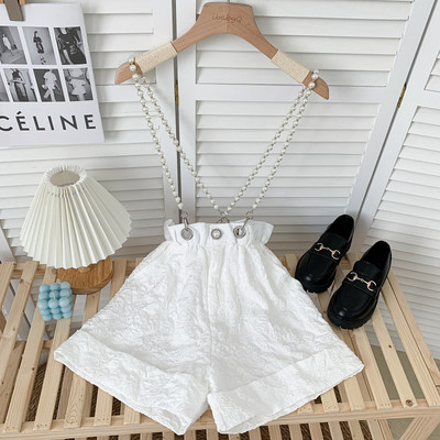 Moderni sieviešu šorti ar pērļu ķēdīti baltā un melnā krāsā