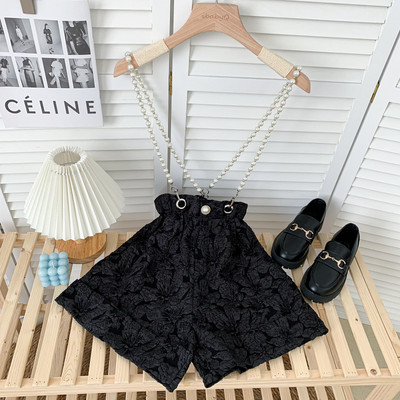 Moderni sieviešu šorti ar pērļu ķēdīti baltā un melnā krāsā