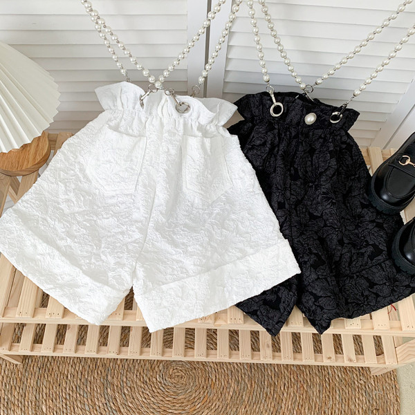 Moderni sieviešu šorti ar pērļu ķēdīti baltā un melnā krāsā