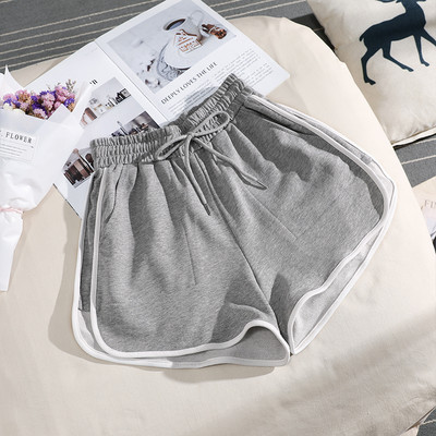 Sieviešu sporta šorti ar apmali vienkrāsainu modeli