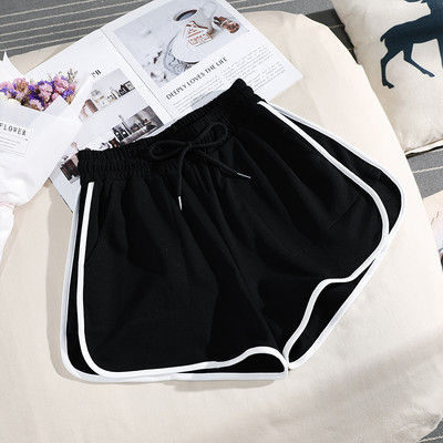 Sieviešu sporta šorti ar apmali vienkrāsainu modeli