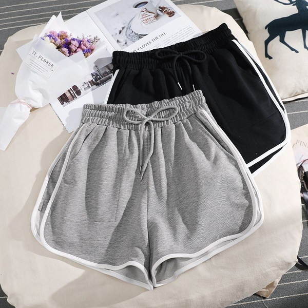 Sieviešu sporta šorti ar apmali vienkrāsainu modeli