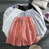 Sieviešu sporta bikses ar saitēm un pogām 3/4 garumā