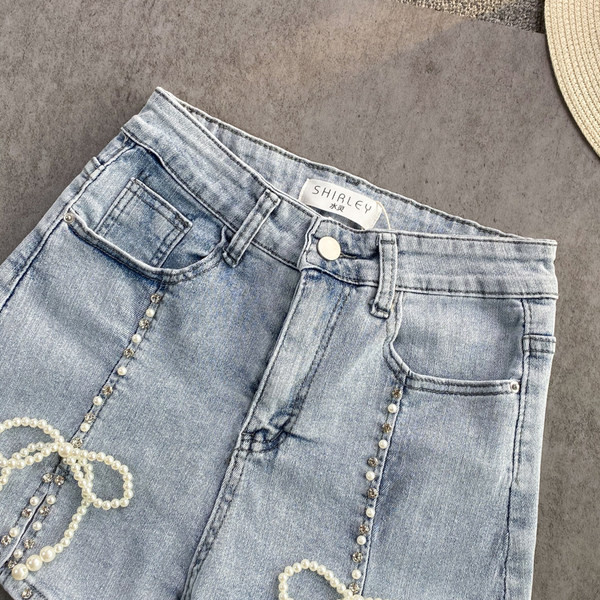 Sieviešu džinsa šorti ar pērlēm un lentītēm