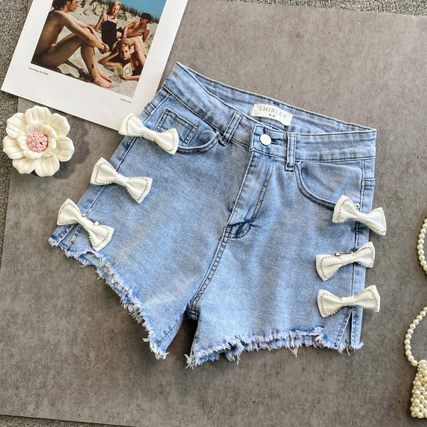 Sieviešu džinsa šorti ar lentīti zilā krāsā