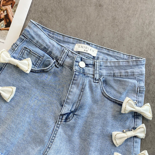 Sieviešu džinsa šorti ar lentīti zilā krāsā