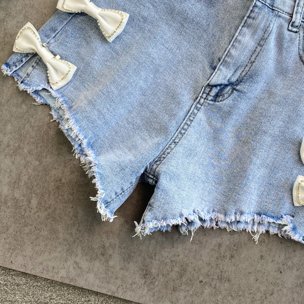 Sieviešu džinsa šorti ar lentīti zilā krāsā