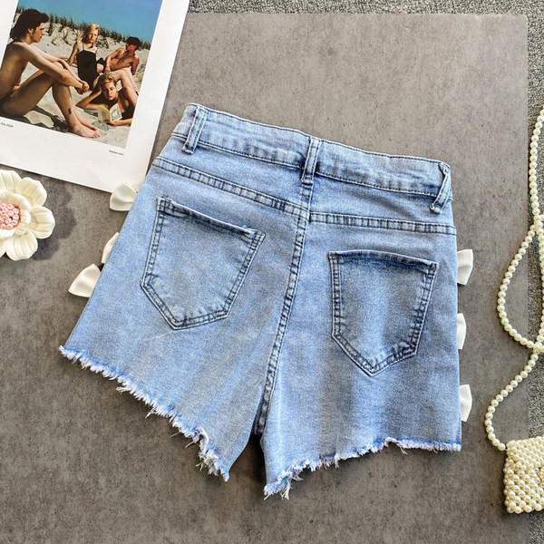 Sieviešu džinsa šorti ar lentīti zilā krāsā