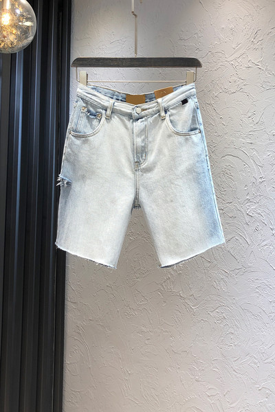 Sieviešu džinsi ar kabatām zilā krāsā