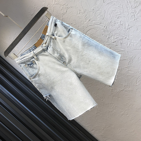 Sieviešu džinsi ar kabatām zilā krāsā