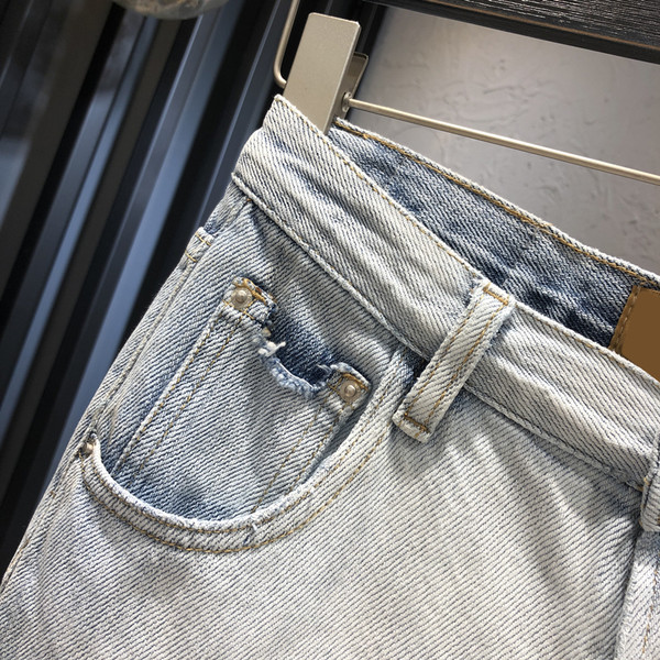 Sieviešu džinsi ar kabatām zilā krāsā