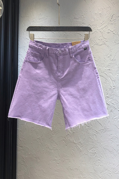 Sieviešu džinsi ar kabatām un augstu vidukli