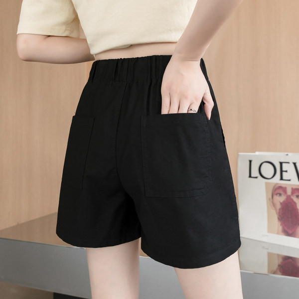 Sieviešu šorti ar saitēm un emblēmu