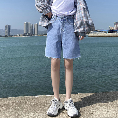 Sieviešu džinsi ar saplēstām tiesībām zilā krāsā