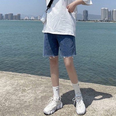 Sieviešu džinsi ar saplēstām tiesībām zilā krāsā