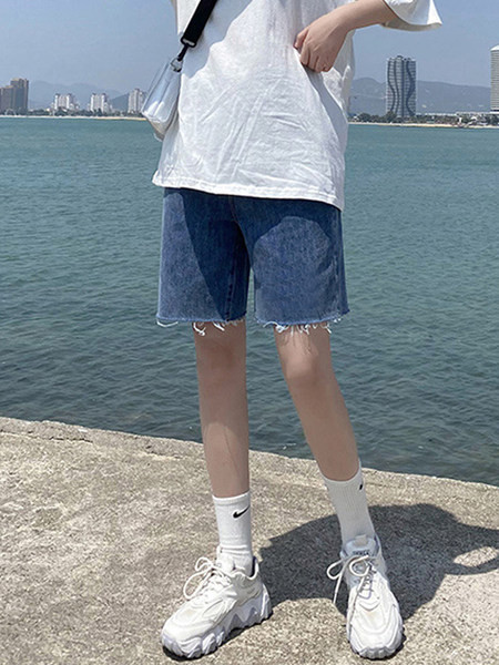 Sieviešu džinsi ar saplēstām tiesībām zilā krāsā