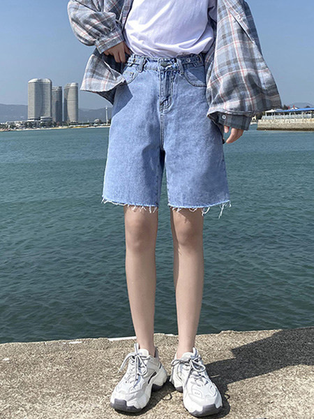 Sieviešu džinsi ar saplēstām tiesībām zilā krāsā