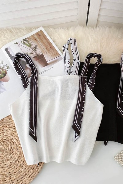 Sieviešu bikses ar lencēm melnā un baltā krāsā