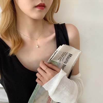 Sieviešu vienkrāsains kokvilnas tops ar ovālu kakla izgriezumu