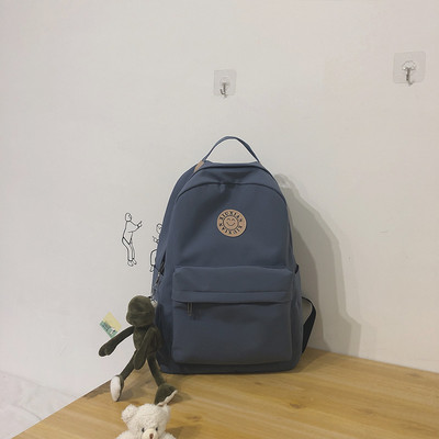 Rucsac modern pentru femei cu buzunar frontal și element 3D