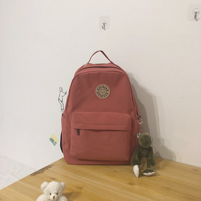 Rucsac modern pentru femei cu buzunar frontal și element 3D