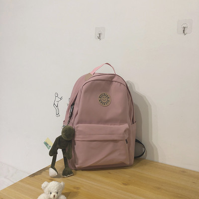 Rucsac modern pentru femei cu buzunar frontal și element 3D