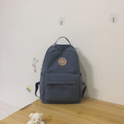 Rucsac modern pentru femei cu buzunar frontal și element 3D