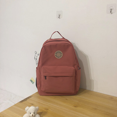 Rucsac modern pentru femei cu buzunar frontal și element 3D