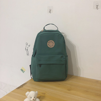 Rucsac modern pentru femei cu buzunar frontal și element 3D