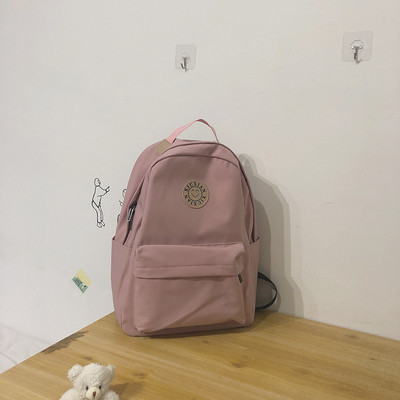 Rucsac modern pentru femei cu buzunar frontal și element 3D