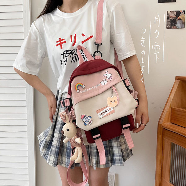 Unisex modeļa tekstila mugursoma ar platām lencēm