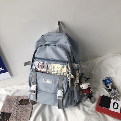 Ženski moderan ruksak sa natpisom i dodatkom