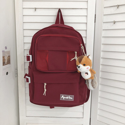 Sieviešu vienkrāsaina mugursoma ar aksesuāru un priekšējo kabatu