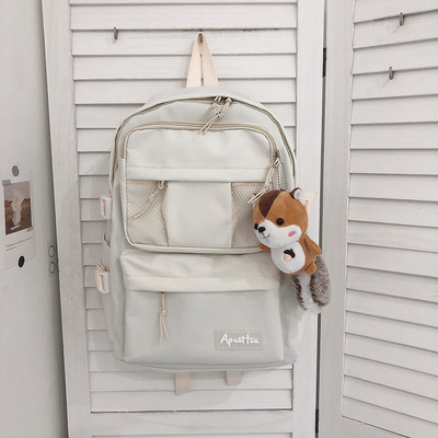 Sieviešu vienkrāsaina mugursoma ar aksesuāru un priekšējo kabatu