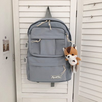 Sieviešu vienkrāsaina mugursoma ar aksesuāru un priekšējo kabatu