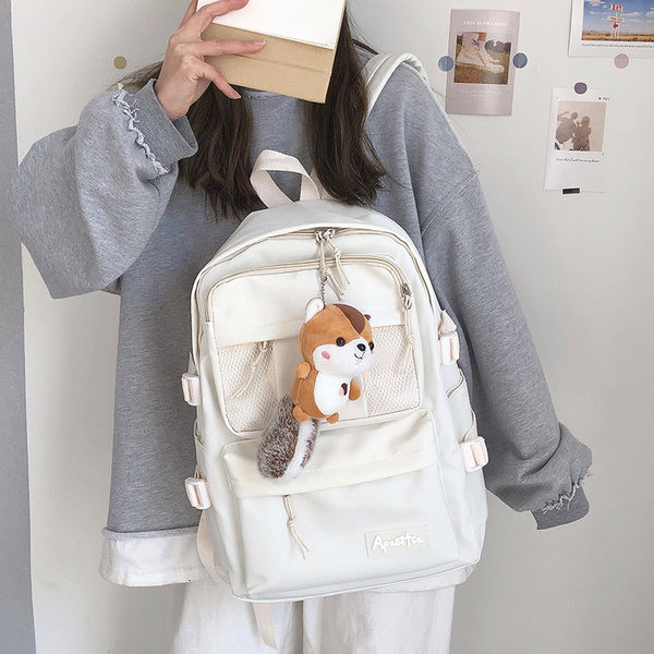 Sieviešu vienkrāsaina mugursoma ar aksesuāru un priekšējo kabatu