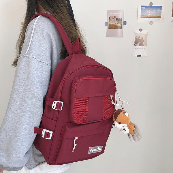 Sieviešu vienkrāsaina mugursoma ar aksesuāru un priekšējo kabatu