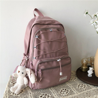 Sieviešu mugursoma ar šņorēm un priekšējo kabatu vairākās krāsās